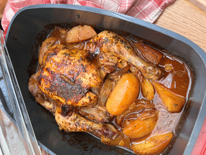 Whole chicken with spices and potatoes